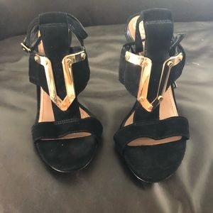 Black and gold heels
